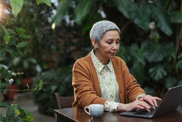 Here's a lady using her laptop to plan for inheritance tax